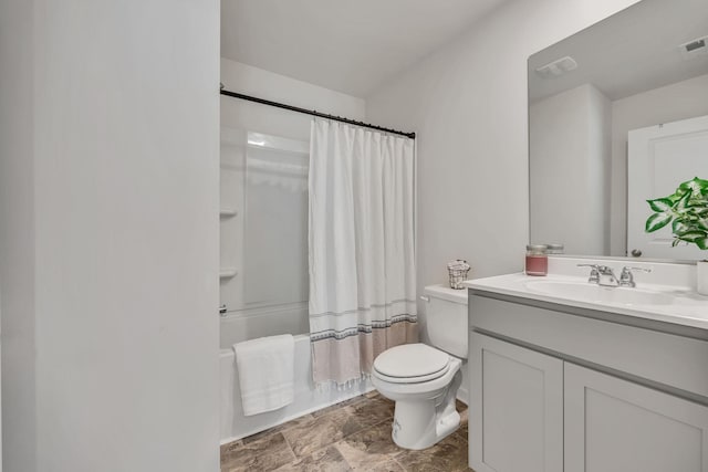 full bathroom with vanity, visible vents, shower / bath combination with curtain, toilet, and stone finish flooring
