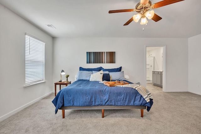 bedroom with light colored carpet, baseboards, and visible vents