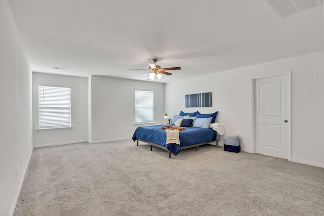 bedroom featuring carpet floors, ceiling fan, visible vents, and baseboards