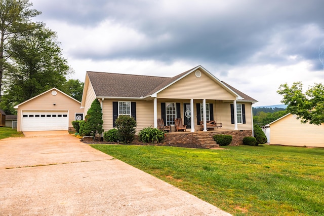 ranch-style home with an outdoor structure, a front lawn, covered porch, roof with shingles, and a detached garage