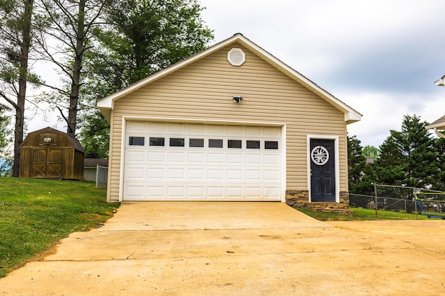 detached garage featuring fence