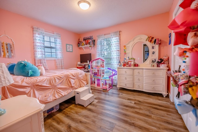 bedroom featuring light wood-style flooring