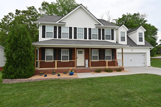 view of front of home featuring a porch, driveway, a front lawn, and a garage