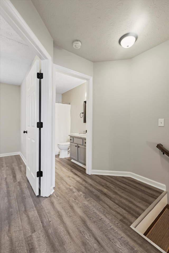 17 Bama Ln Unit C5, Ringgold, GA 30736 - corridor with wood finished floors, a textured ceiling, and baseboards