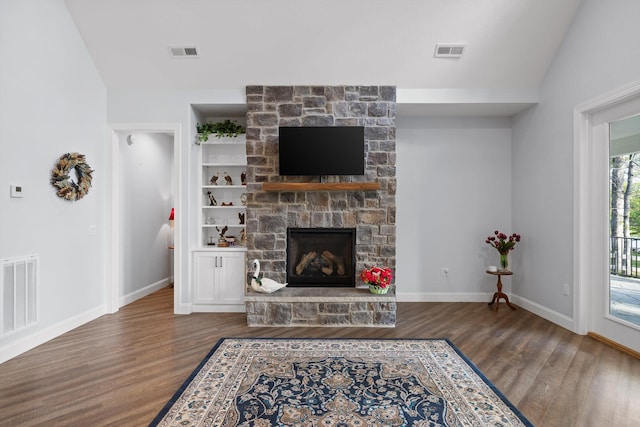 234 Reflection Dr, Dunlap, TN 37327 - living room with wood finished floors, a fireplace, vaulted ceiling, built in features, and baseboards