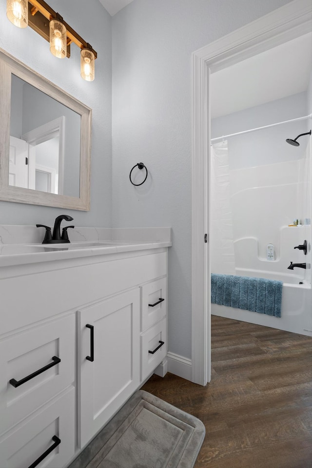 234 Reflection Dr, Dunlap, TN 37327 - bathroom featuring vanity, wood finished floors, shower / bath combination with curtain, and baseboards