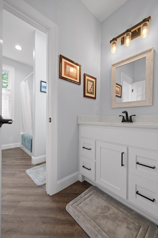 234 Reflection Dr, Dunlap, TN 37327 - full bathroom with baseboards, wood finished floors, vanity, and recessed lighting