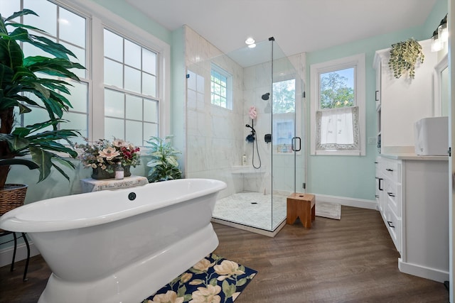 234 Reflection Dr, Dunlap, TN 37327 - full bathroom with a stall shower, a soaking tub, wood finished floors, baseboards, and vanity