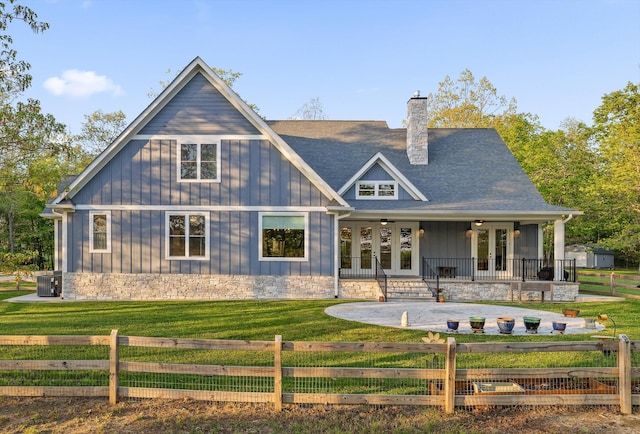 234 Reflection Dr, Dunlap, TN 37327 - rear view of property featuring french doors, board and batten siding, a chimney, and central AC