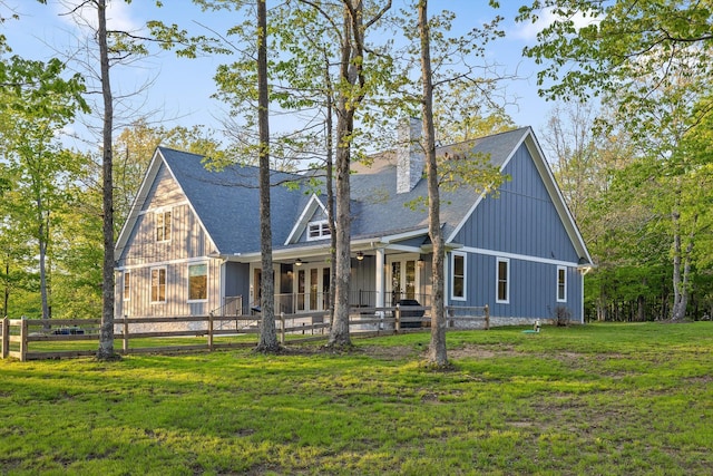 234 Reflection Dr, Dunlap, TN 37327 - view of front facade with french doors, a chimney, board and batten siding, and roof with shingles