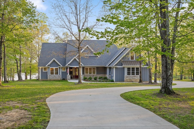 234 Reflection Dr, Dunlap, TN 37327 - craftsman house featuring curved driveway, stone siding, a front yard, and board and batten siding