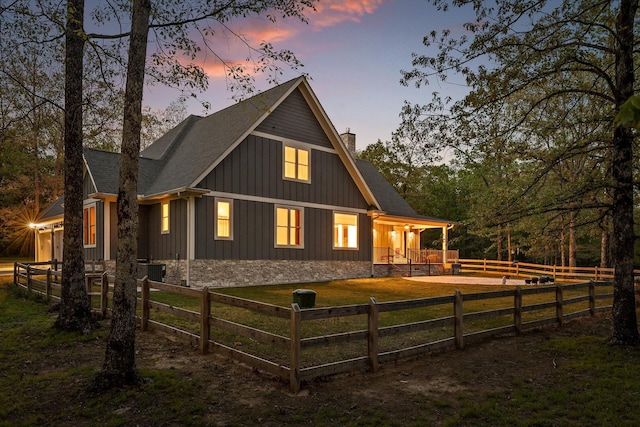 234 Reflection Dr, Dunlap, TN 37327 - rear view of house with a chimney, board and batten siding, a fenced front yard, a porch, and a shingled roof