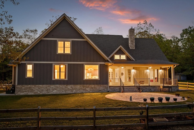 234 Reflection Dr, Dunlap, TN 37327 - back of property with a chimney, covered porch, stone siding, and board and batten siding
