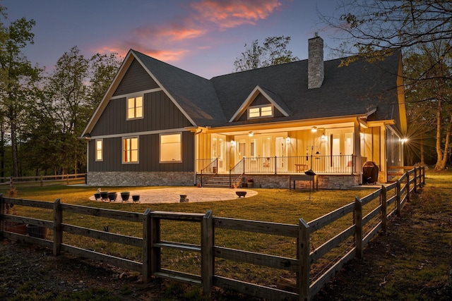 234 Reflection Dr, Dunlap, TN 37327 - back of property with board and batten siding, a chimney, and a shingled roof