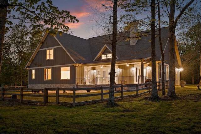 234 Reflection Dr, Dunlap, TN 37327 - back of house at dusk featuring a chimney and a shingled roof