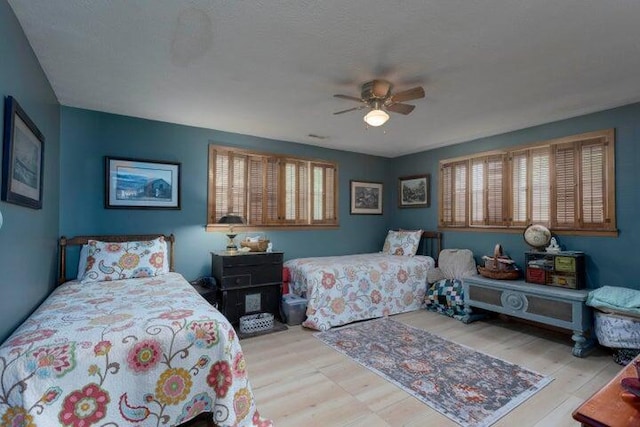 292 Hilltop Cir, Spring City, TN 37381 - bedroom featuring a ceiling fan, multiple windows, and wood finished floors