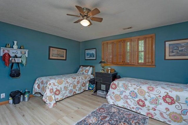 292 Hilltop Cir, Spring City, TN 37381 - bedroom with a ceiling fan, wood finished floors, and visible vents