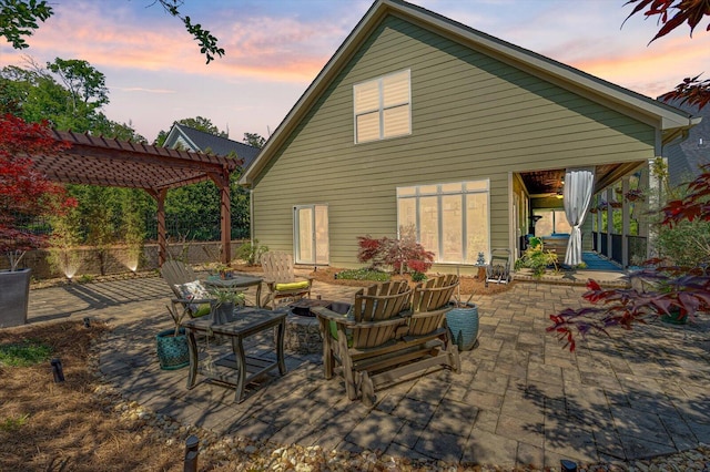 1383 Carrington Way, Chattanooga, TN 37405 - back of house at dusk featuring a patio, a pergola, and an outdoor living space