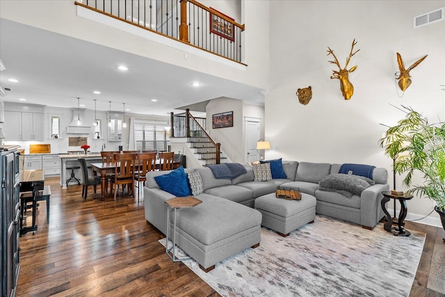 1383 Carrington Way, Chattanooga, TN 37405 - living room with stairway, visible vents, dark wood-style floors, and a towering ceiling