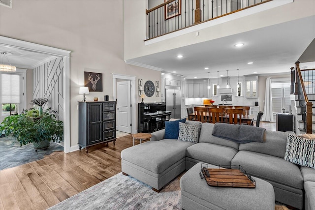 1383 Carrington Way, Chattanooga, TN 37405 - living room featuring wood finished floors, ornamental molding, recessed lighting, an inviting chandelier, and a high ceiling