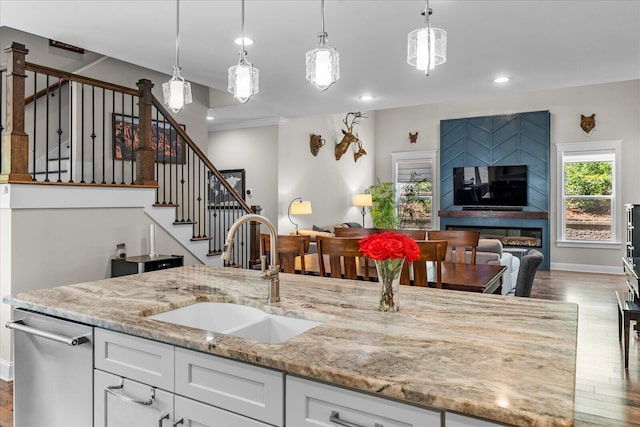 1383 Carrington Way, Chattanooga, TN 37405 - kitchen with light stone countertops, a sink, open floor plan, wood finished floors, and white cabinets