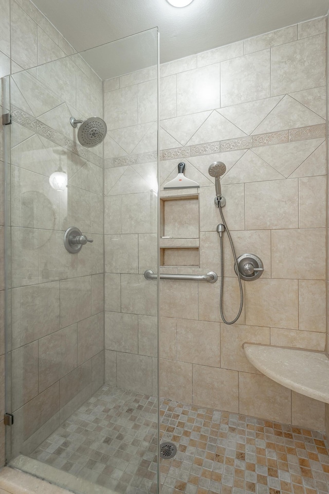 bathroom with a shower stall