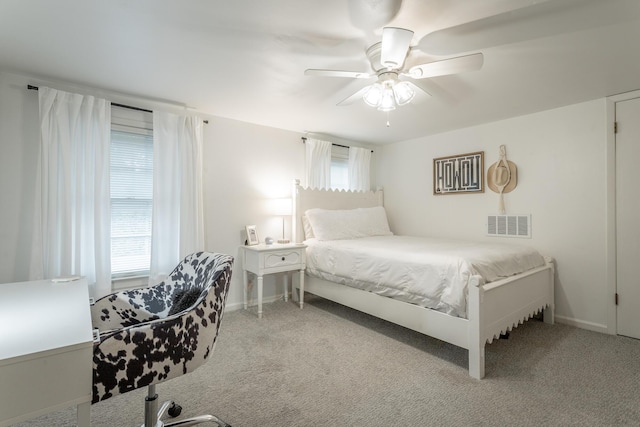 bedroom featuring baseboards, carpet flooring, and visible vents