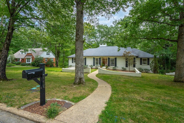 single story home with a shingled roof and a front lawn