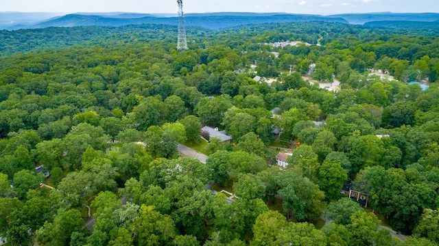 aerial view with a wooded view and a mountain view