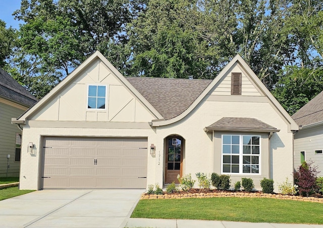 28 Emmeline Way, Hixson, TN 37343 - view of front of home featuring a shingled roof, driveway, a front lawn, and a garage
