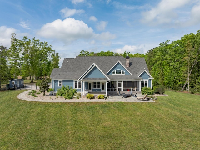 3086 Poe Rd, Soddy Daisy, TN 37379 - back of property with a patio, a sunroom, a yard, and a chimney