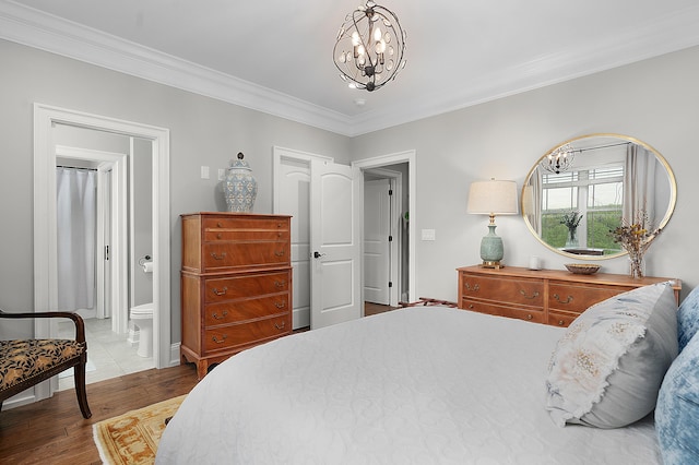 3086 Poe Rd, Soddy Daisy, TN 37379 - bedroom with a chandelier, ornamental molding, wood finished floors, ensuite bathroom, and baseboards