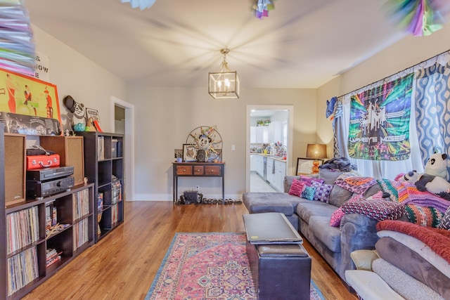 109 Sequoia Dr, Chattanooga, TN 37411 - living room with wood finished floors, a chandelier, and baseboards