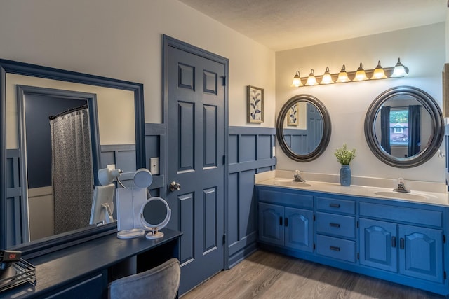 9505 Post Oak Dr, Ooltewah, TN 37363 - full bath featuring a sink, double vanity, wainscoting, and wood finished floors