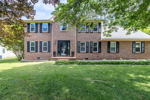 9505 Post Oak Dr, Ooltewah, TN 37363 - colonial-style house with a front yard, crawl space, and brick siding