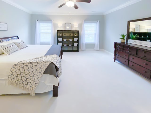 bedroom featuring carpet flooring, a ceiling fan, and ornamental molding