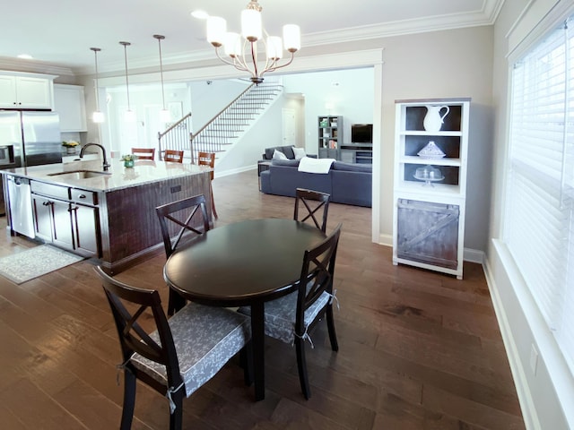 dining room with baseboards, ornamental molding, a notable chandelier, and dark wood-type flooring