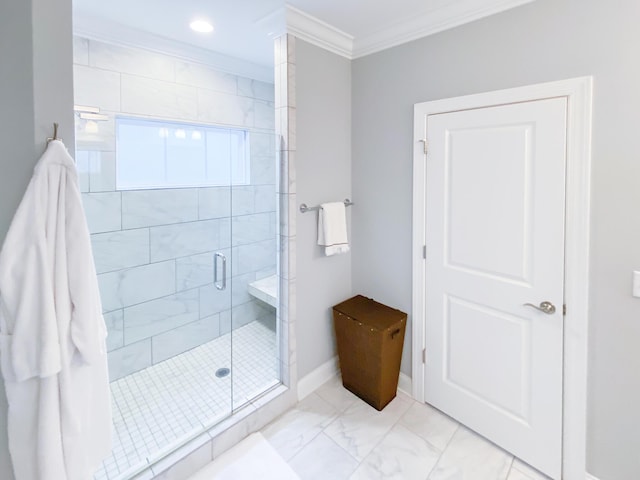bathroom featuring crown molding, baseboards, a stall shower, and marble finish floor