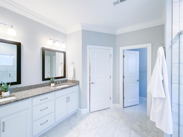 full bath featuring crown molding, a sink, double vanity, marble finish floor, and baseboards