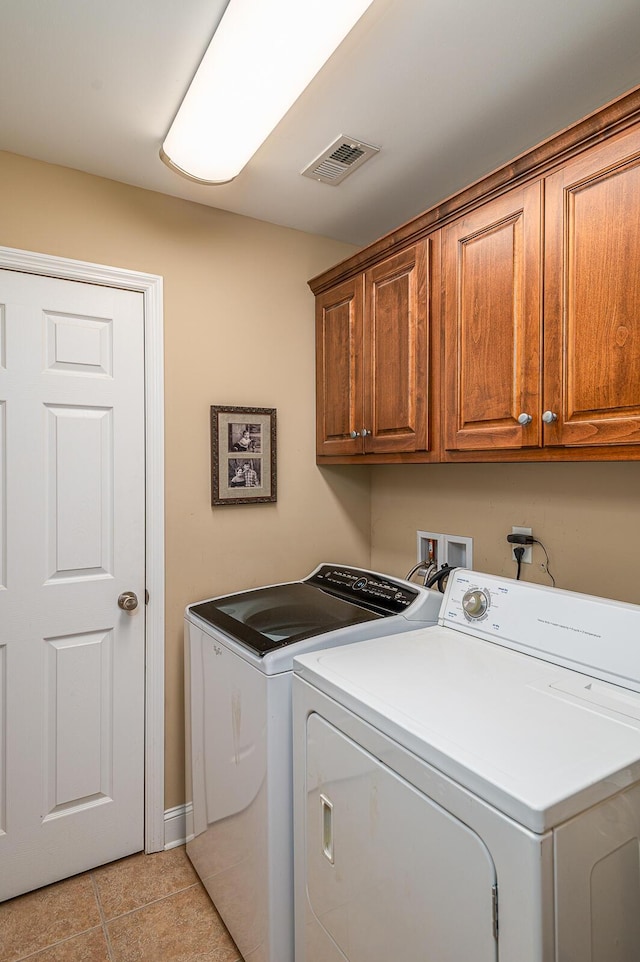 8337 Kayla Rose Cir, Ooltewah, TN 37363 - washroom with washer and clothes dryer, cabinet space, and light tile patterned floors