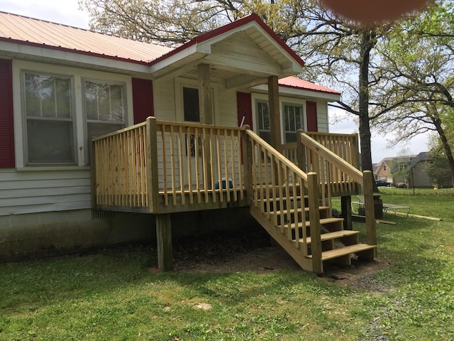 7319 Ooltewah Georgetown Rd, Ooltewah, TN 37363 - rear view of property with metal roof, a lawn, and a deck