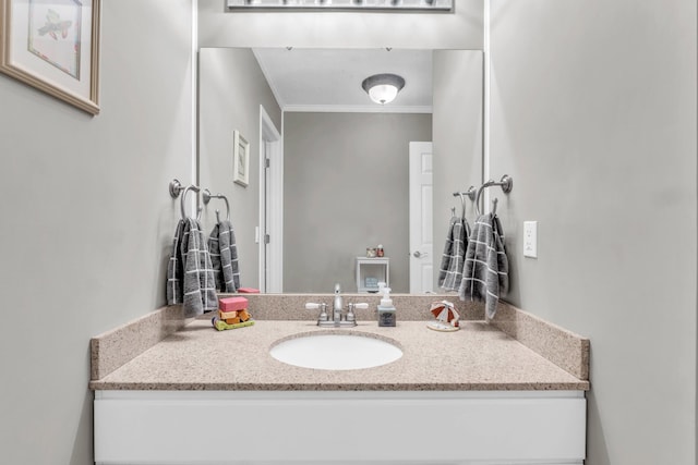 bathroom with vanity and ornamental molding
