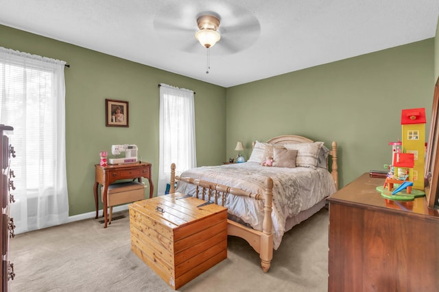 bedroom with baseboards, light colored carpet, and ceiling fan