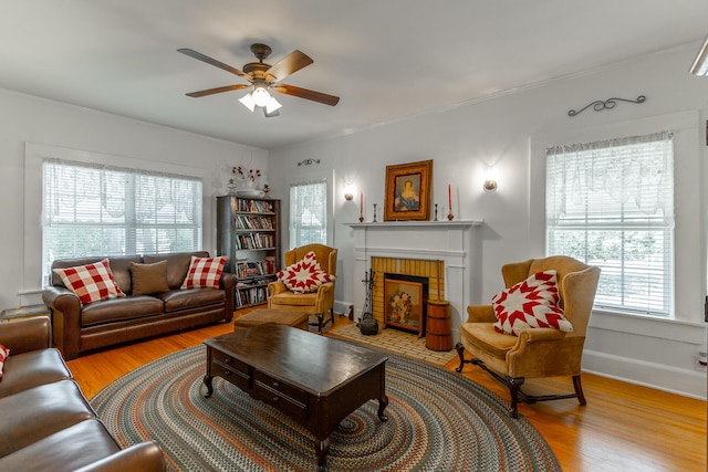 204 Lee-Gordon Mill Rd, Chickamauga, GA 30707 - living area featuring light wood-style flooring, ceiling fan, and a fireplace