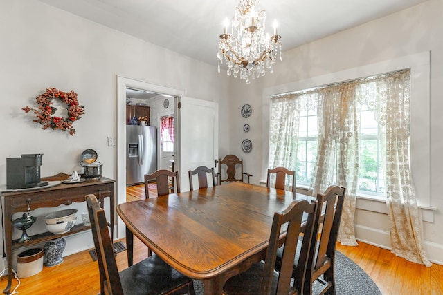 204 Lee-Gordon Mill Rd, Chickamauga, GA 30707 - dining space featuring a chandelier and light wood-style floors
