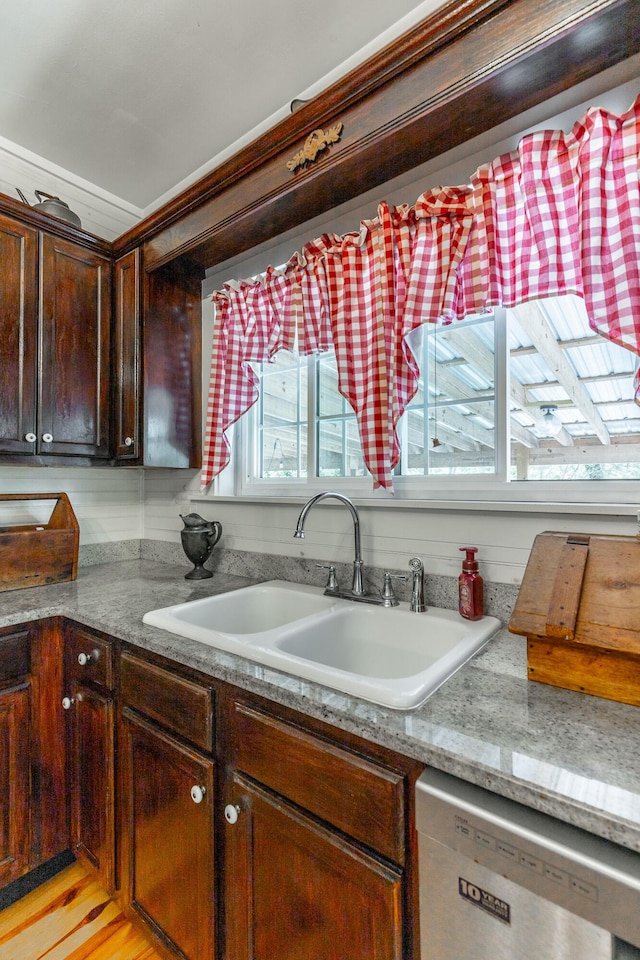 204 Lee-Gordon Mill Rd, Chickamauga, GA 30707 - kitchen featuring stainless steel dishwasher, a sink, dark brown cabinetry, and light stone counters