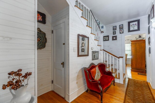 204 Lee-Gordon Mill Rd, Chickamauga, GA 30707 - foyer featuring stairway, wood finished floors, wood walls, and vaulted ceiling