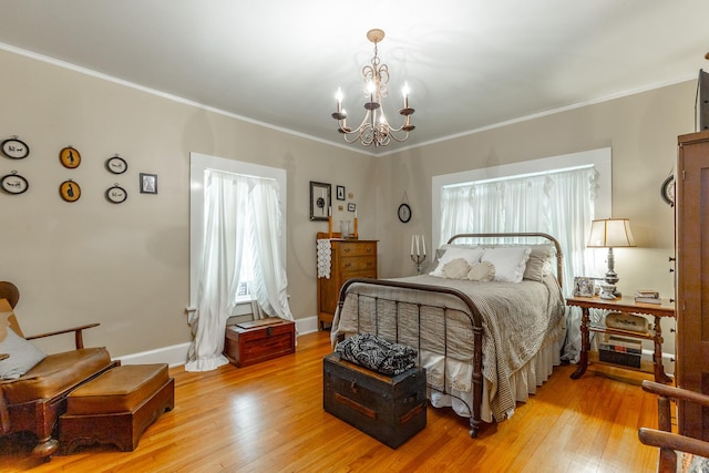 204 Lee-Gordon Mill Rd, Chickamauga, GA 30707 - bedroom with a chandelier, light wood-type flooring, ornamental molding, and baseboards