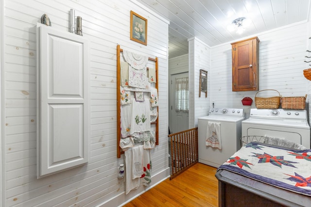 204 Lee-Gordon Mill Rd, Chickamauga, GA 30707 - laundry area with washing machine and clothes dryer, cabinet space, wood walls, light wood-style floors, and wooden ceiling