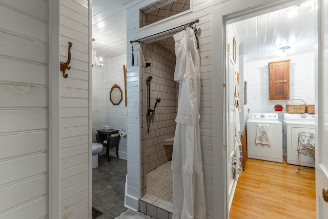 204 Lee-Gordon Mill Rd, Chickamauga, GA 30707 - full bath with washer and dryer, toilet, a shower stall, and wood finished floors